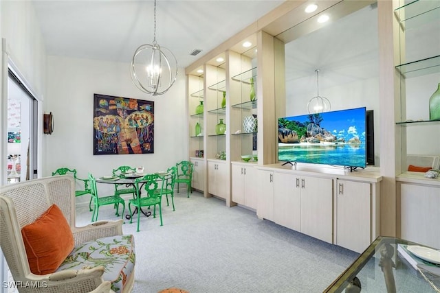 living area with light carpet, visible vents, an inviting chandelier, and recessed lighting