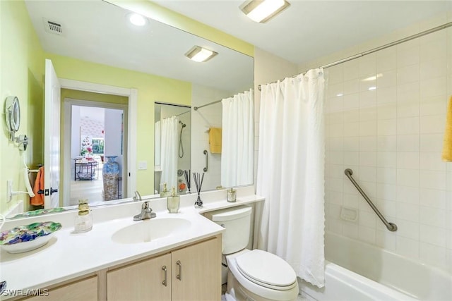 full bathroom with toilet, vanity, visible vents, and shower / tub combo