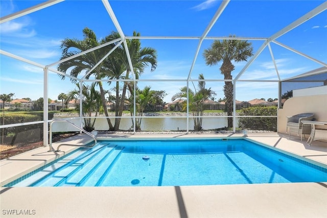 pool featuring a water view, a patio, and a lanai
