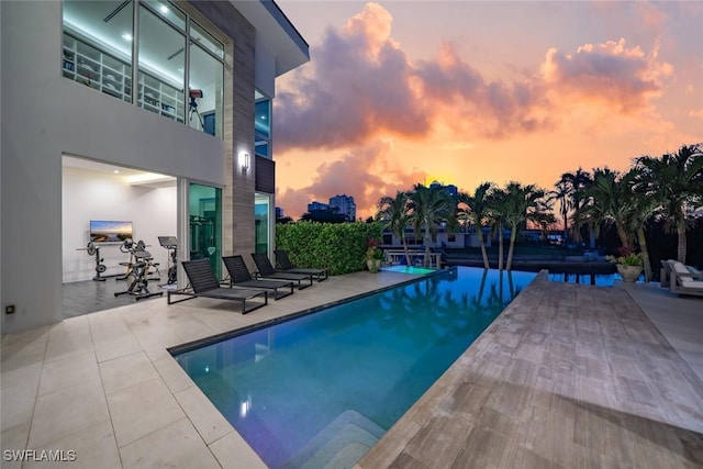 pool with a patio area