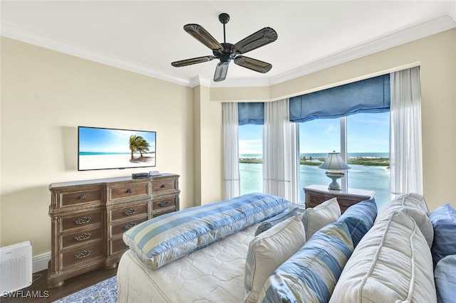 bedroom with ceiling fan, dark hardwood / wood-style floors, and ornamental molding