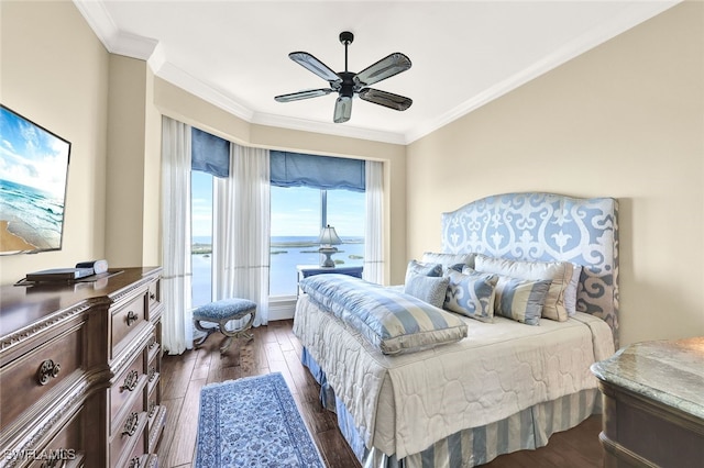 bedroom featuring ceiling fan, dark hardwood / wood-style floors, a water view, and ornamental molding