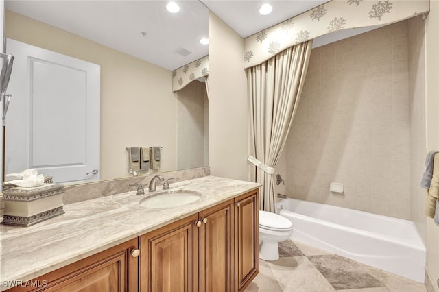 full bathroom with shower / bath combo with shower curtain, vanity, and toilet