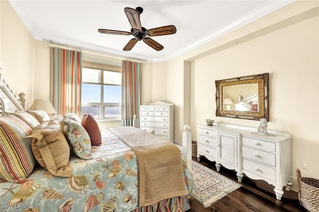 bedroom with dark hardwood / wood-style floors, ceiling fan, and ornamental molding