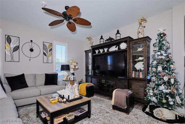 living room featuring ceiling fan and hardwood / wood-style floors