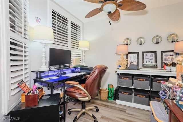 office with hardwood / wood-style floors and ceiling fan