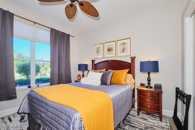 bedroom featuring hardwood / wood-style flooring and ceiling fan