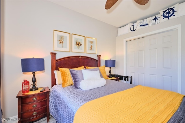 bedroom with ceiling fan and a closet