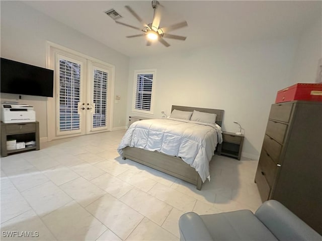 bedroom featuring french doors, access to outside, and ceiling fan