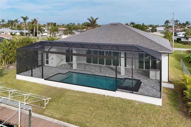 view of pool with a patio area, a lanai, and a lawn