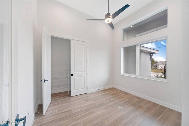 unfurnished bedroom featuring light hardwood / wood-style flooring and ceiling fan