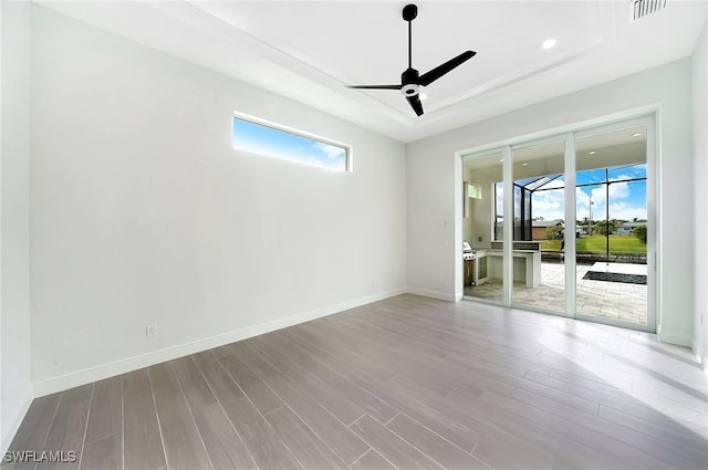 empty room featuring light hardwood / wood-style floors and ceiling fan