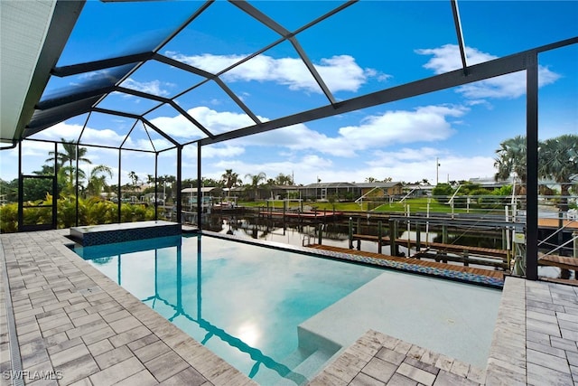 view of swimming pool featuring a lanai, a water view, and a patio