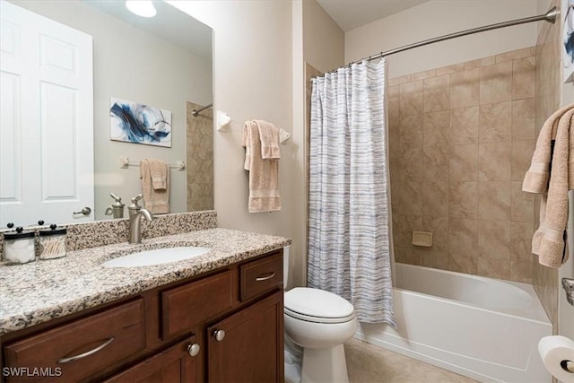 full bathroom featuring vanity, toilet, tile patterned flooring, and shower / tub combo