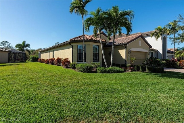 view of side of home featuring a garage, glass enclosure, and a lawn