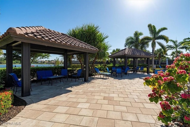 surrounding community with a gazebo and a patio