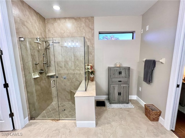 20256 Black Tree Ln, Estero, FL 33928 - bathroom with a stall shower, baseboards, and tile patterned floors