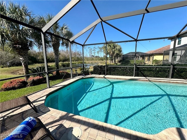 view of swimming pool with a lanai