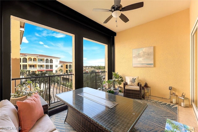 balcony featuring ceiling fan