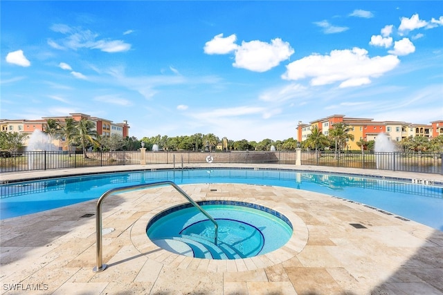 view of pool with a community hot tub