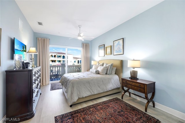 bedroom with ceiling fan, light hardwood / wood-style floors, and access to outside