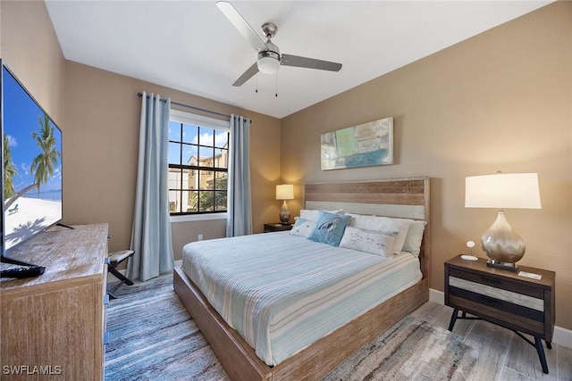 bedroom featuring hardwood / wood-style floors and ceiling fan