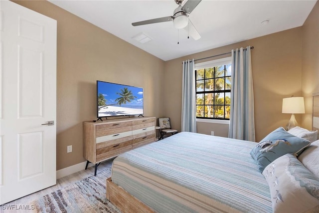 bedroom with hardwood / wood-style flooring and ceiling fan