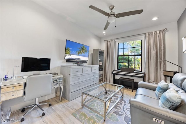 office space featuring ceiling fan and light hardwood / wood-style flooring