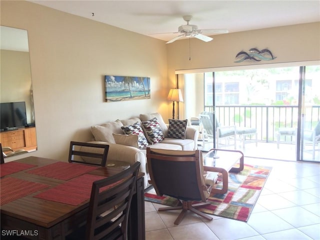 living room featuring ceiling fan and light tile patterned floors