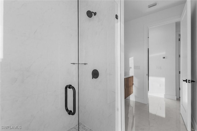 bathroom featuring an enclosed shower