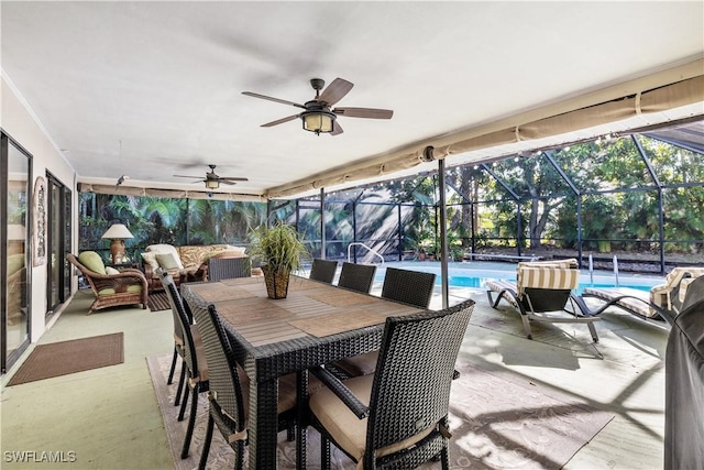 view of patio / terrace featuring ceiling fan and a lanai