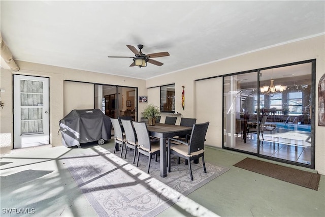 dining area with ceiling fan with notable chandelier and crown molding