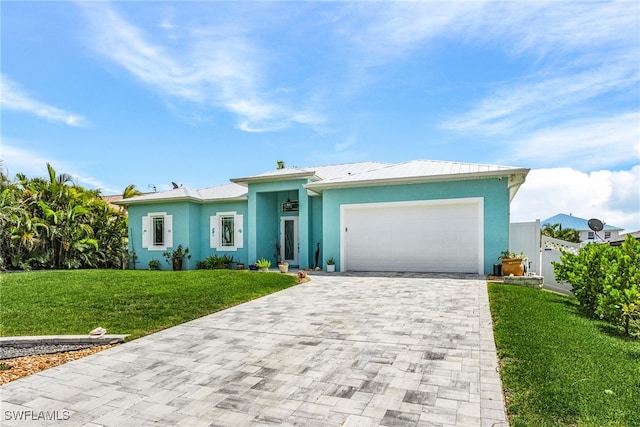 single story home featuring a front yard and a garage