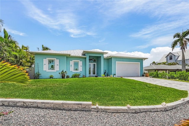 single story home featuring french doors, a garage, and a front lawn