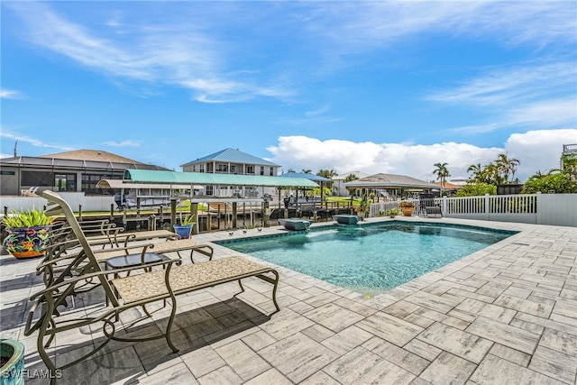 view of swimming pool with a patio