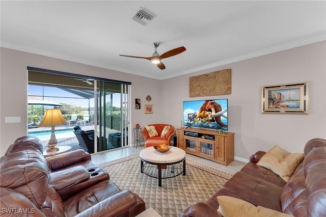 living room featuring ceiling fan, light tile patterned floors, and crown molding