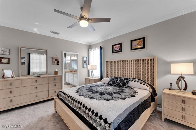 bedroom with ensuite bathroom, crown molding, ceiling fan, and light colored carpet