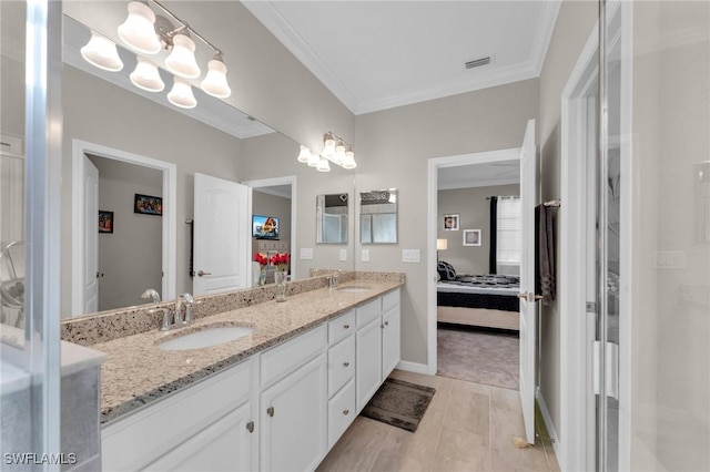 bathroom with crown molding and vanity