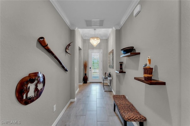 doorway to outside with crown molding and a chandelier