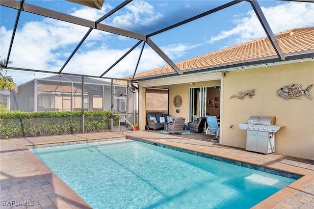 view of swimming pool with a lanai, a patio area, ceiling fan, and area for grilling