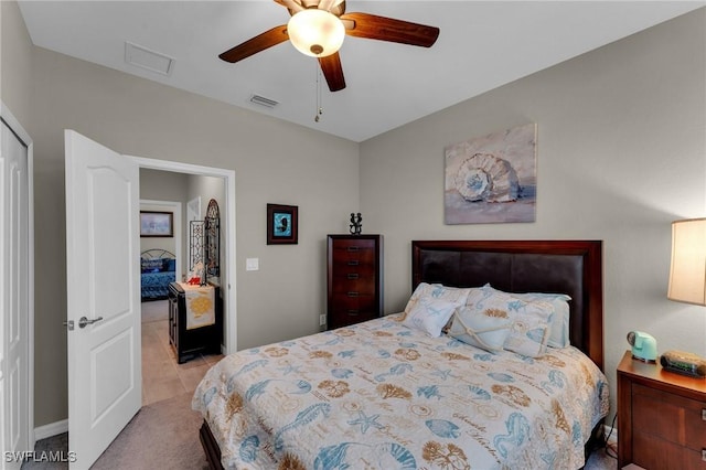 bedroom with ceiling fan and light carpet