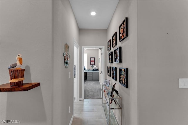 corridor featuring light tile patterned flooring