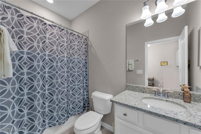 bathroom with a shower with curtain, vanity, and toilet