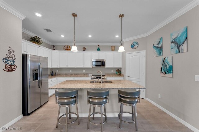 kitchen featuring white cabinetry, sink, a kitchen island with sink, and appliances with stainless steel finishes