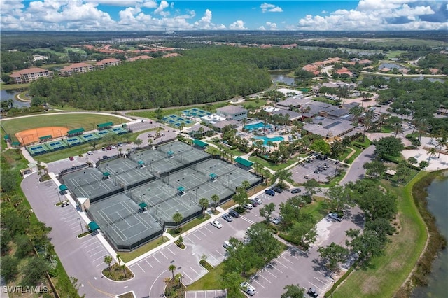 birds eye view of property with a water view