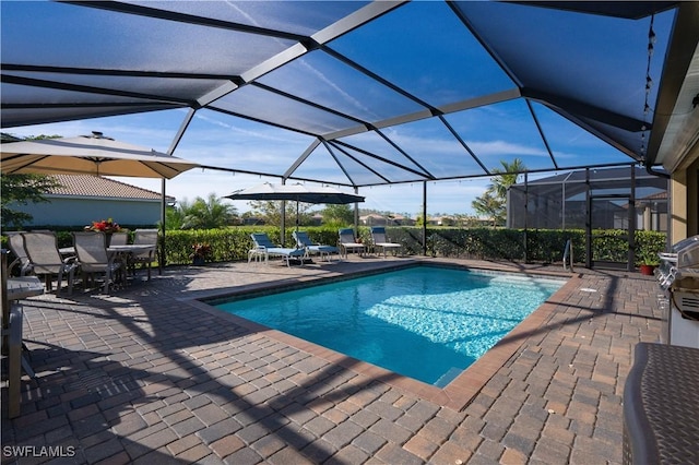 view of pool featuring a lanai and a patio area