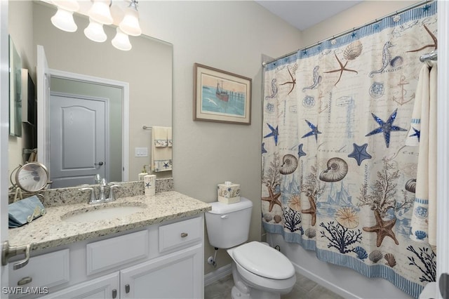 full bathroom featuring tile patterned flooring, vanity, toilet, and shower / tub combo with curtain