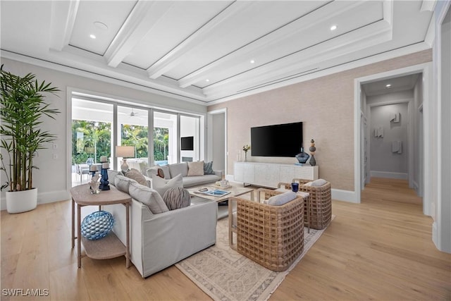 living room with beam ceiling, light hardwood / wood-style floors, and ornamental molding