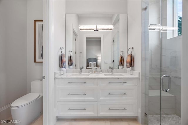 bathroom featuring vanity, toilet, and walk in shower