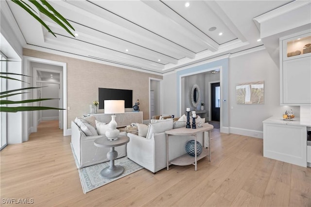 living room featuring beamed ceiling and light hardwood / wood-style floors